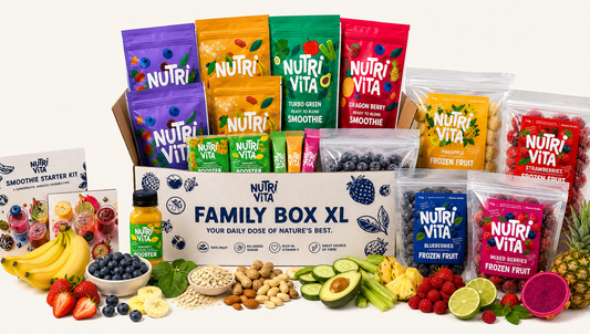 A Nutri Vita Family Box XL gift set arranged on a white background, featuring multiple colorful pouches of smoothies, frozen fruit, and a smoothie starter kit, with fresh fruits and nuts styled around the box.